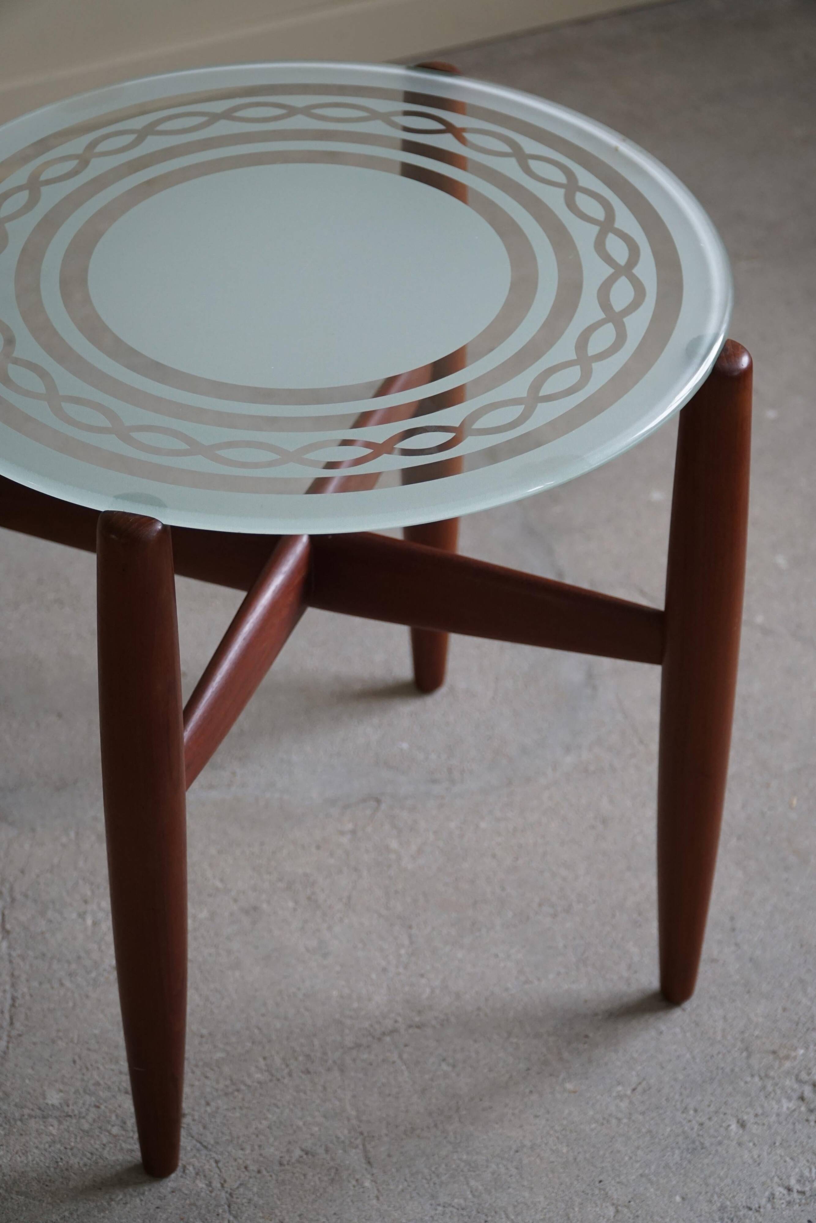 Teak and glass side table, mid-century Danish design, made in the 1960s.