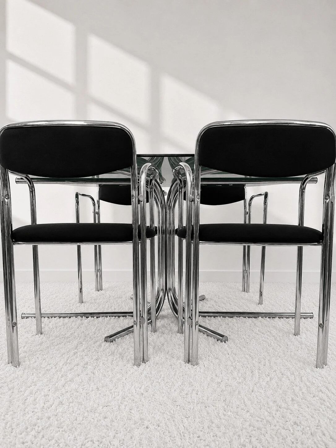 Vintage chairs with double chrome structure and black velvet. 70s
