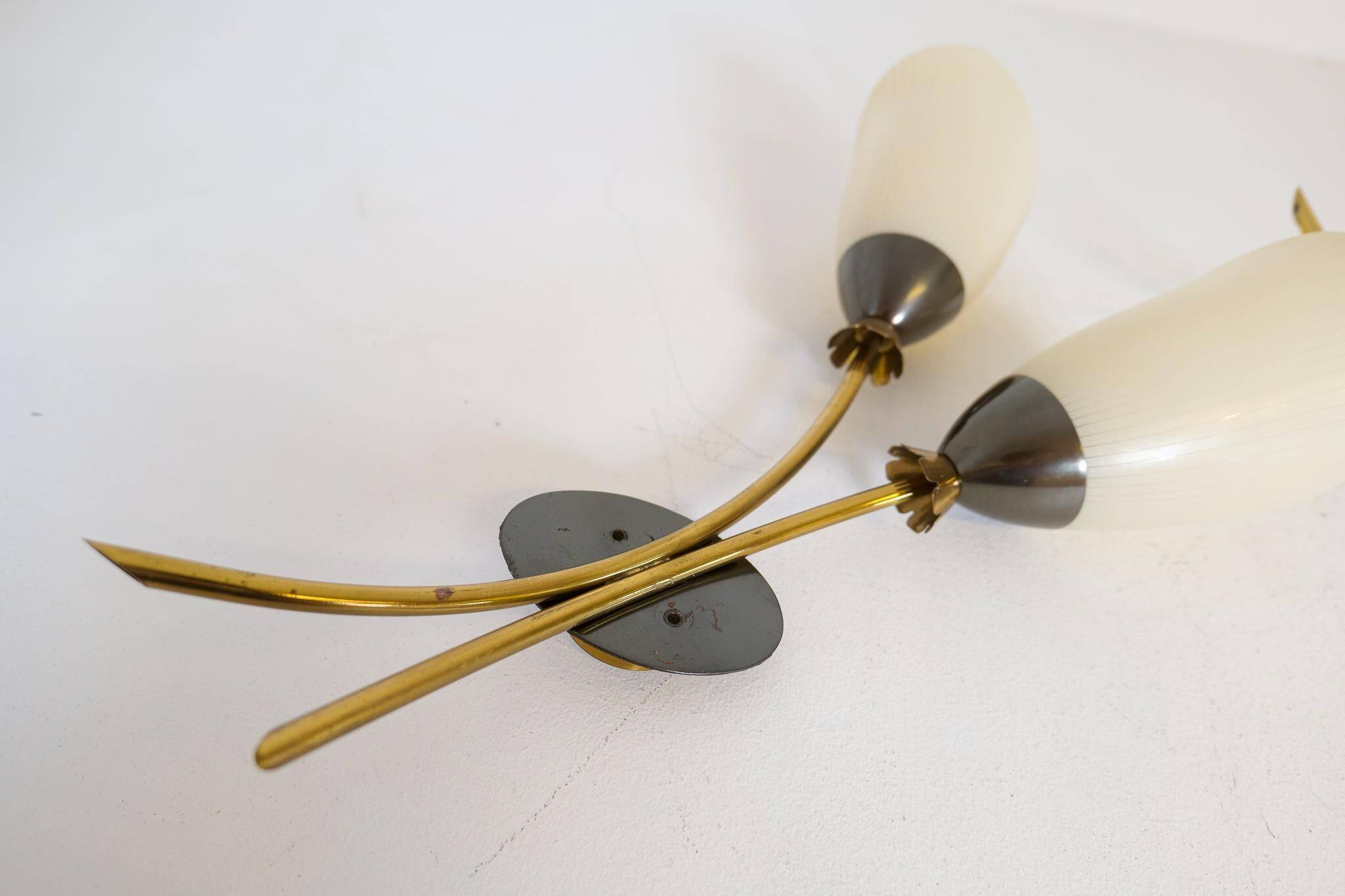 Mid-century pair of wall lamps in brass and opaline attributed to Asea Sweden, 1950s.