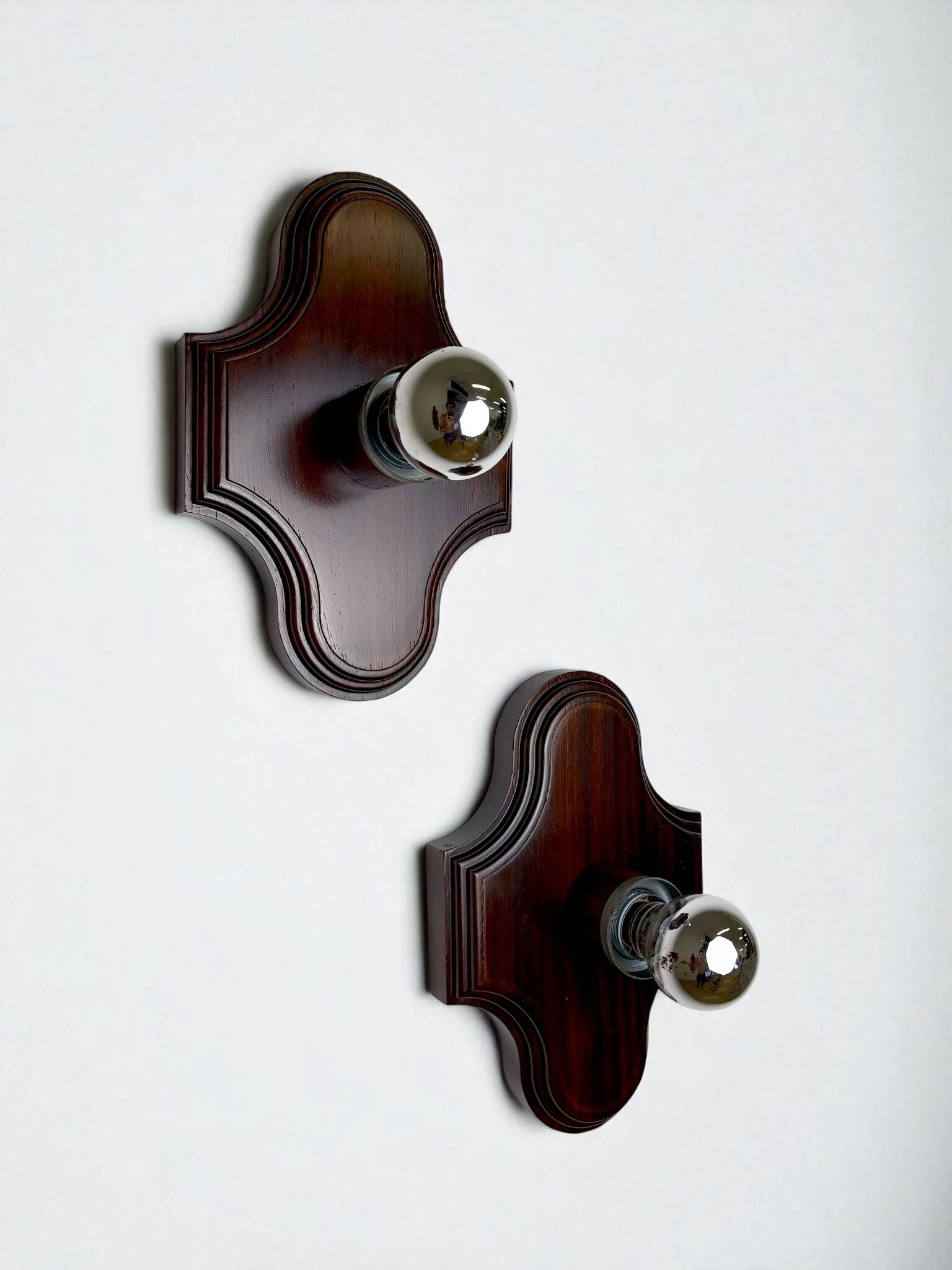 Pair of geometric Art Deco wall lights, carved wood, France, 1960s