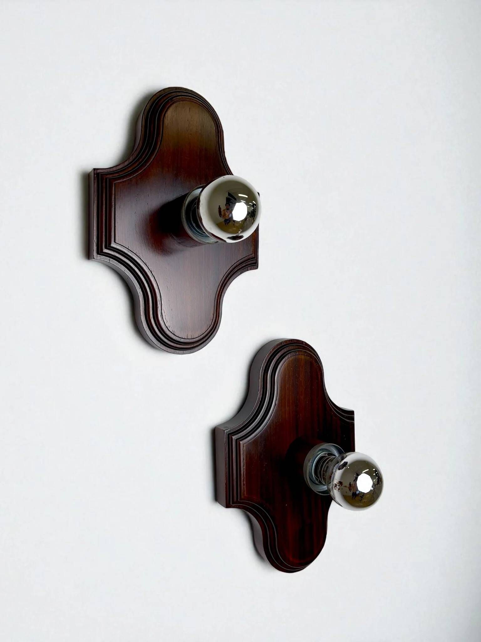 Pair of geometric Art Deco wall lights, carved wood, France, 1960s