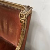 Two Louis XVI style wing chairs in gilded wood, 20th century