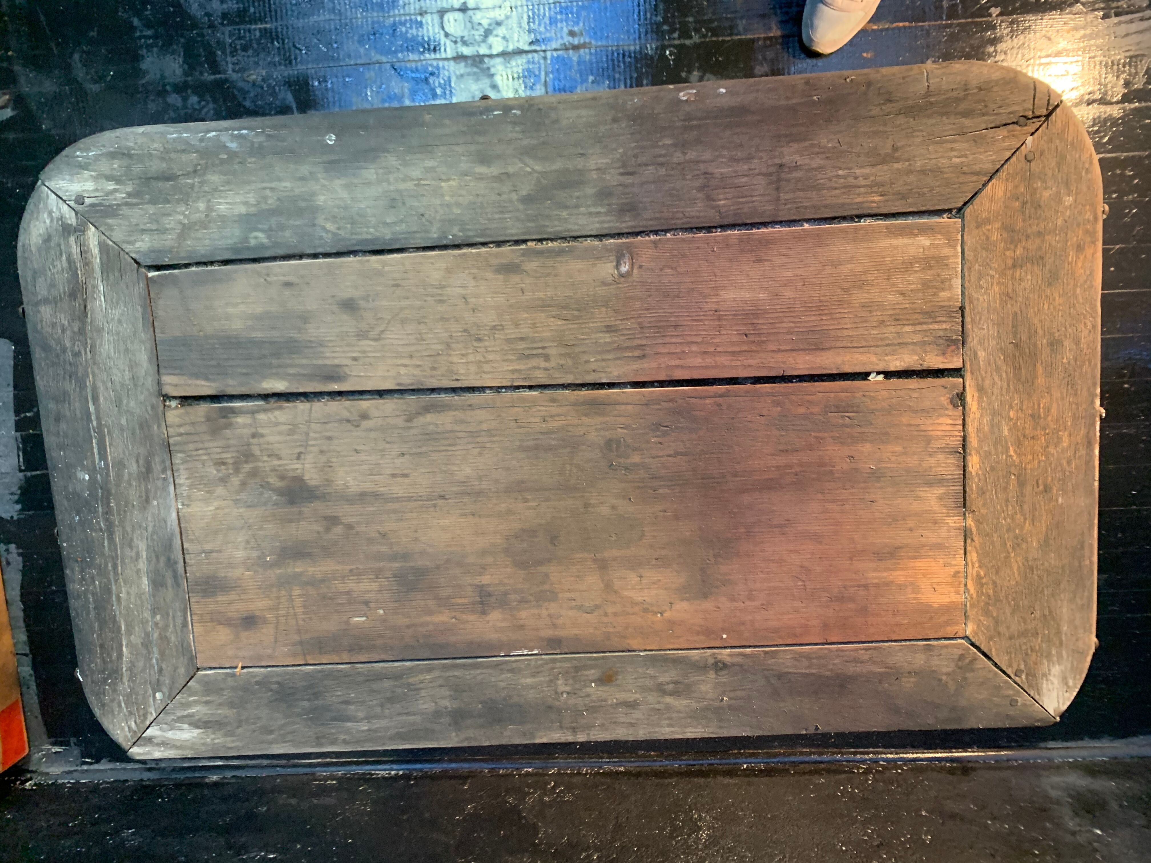 Ancient wrought iron and wood garden table