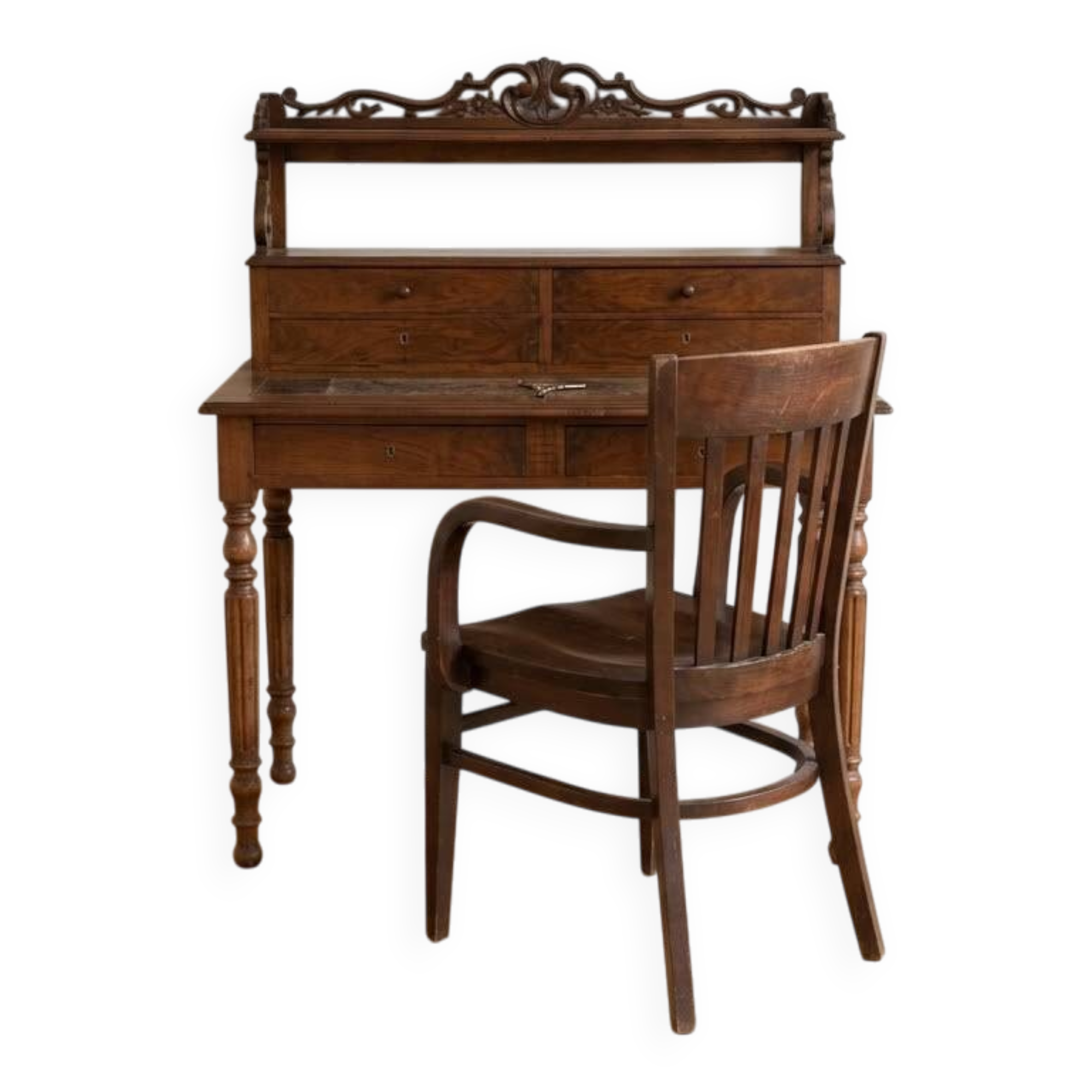 Old wooden tiered desk and its matching chair.