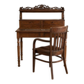 Old wooden tiered desk and its matching chair.