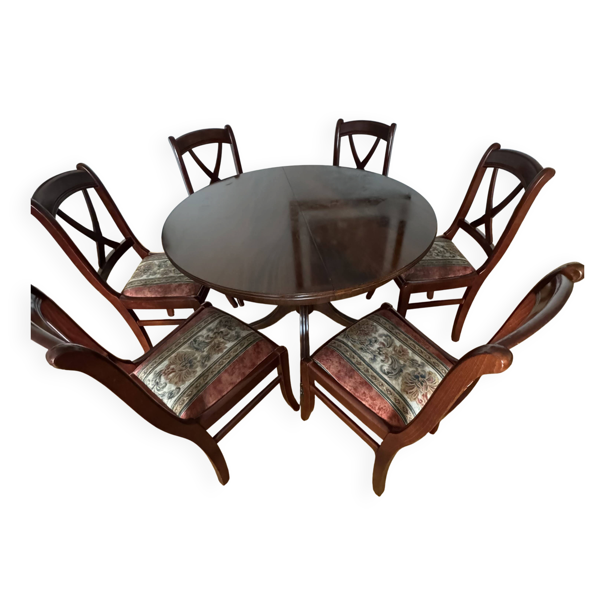 Round mahogany table and beech chairs.