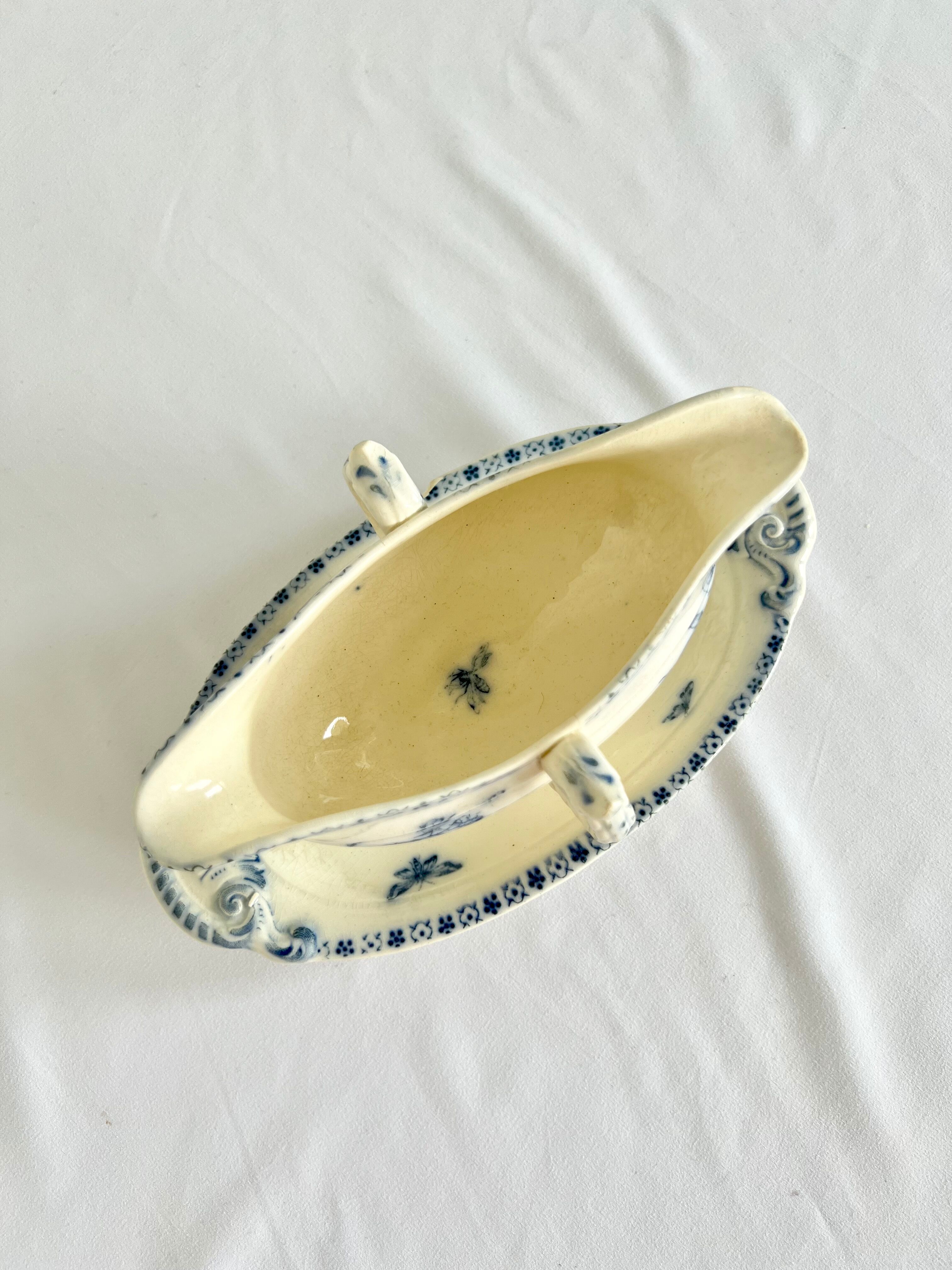 Saucière porcelain stamped Lunéville with double ivory and blue handles