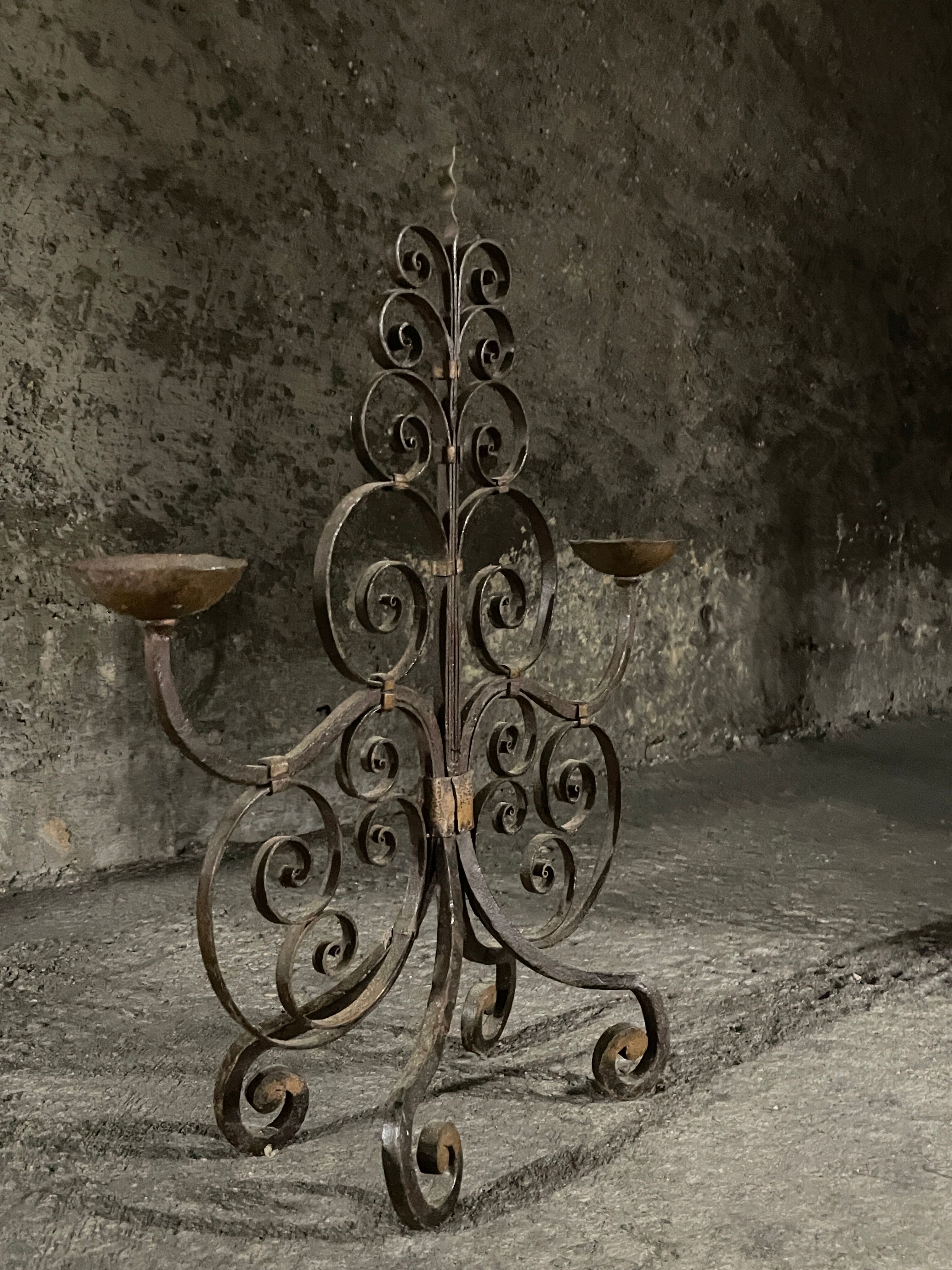 Pair of French wrought iron candelabra from the 19th century.