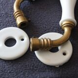 Set of two porcelain door handles with two rosettes