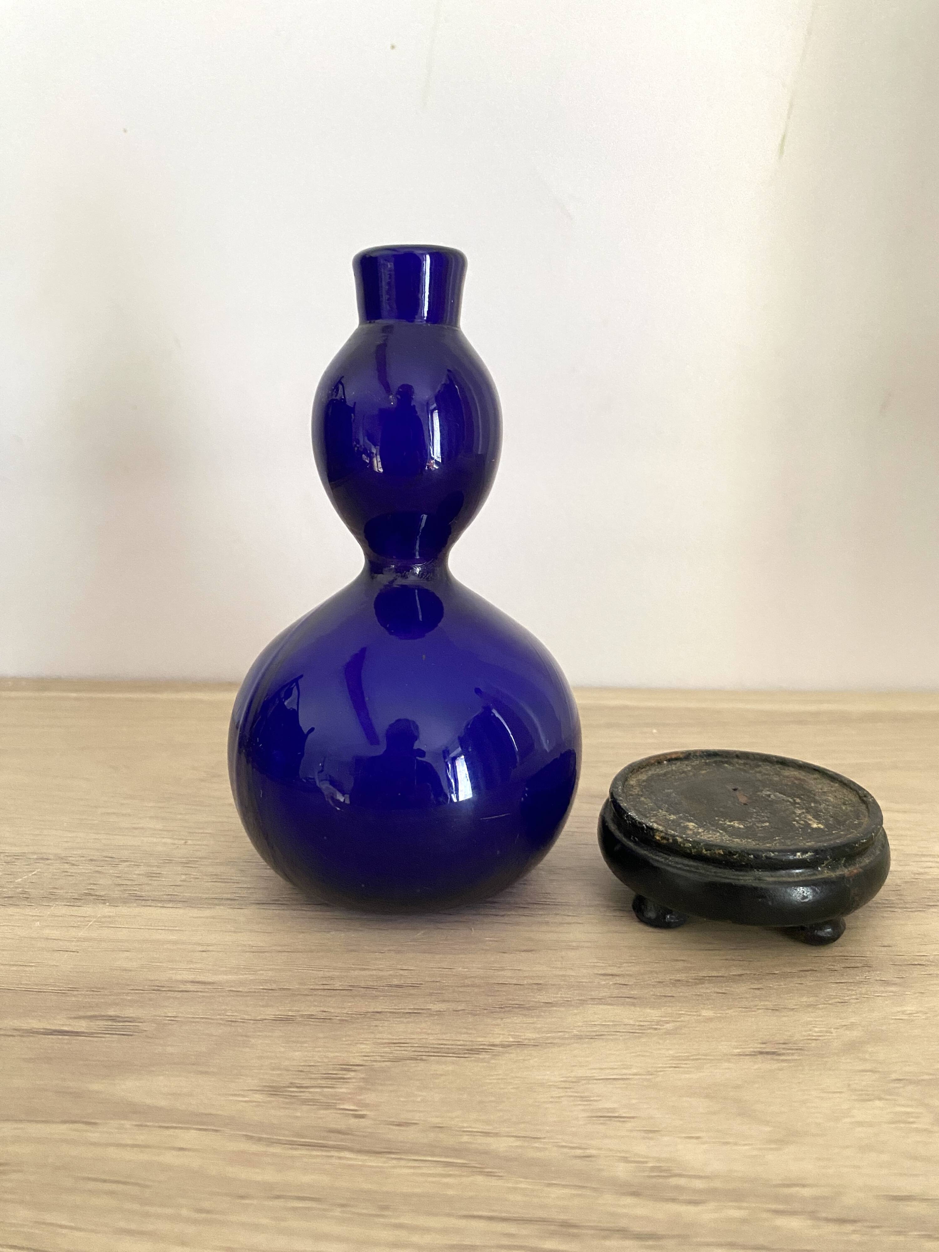 Blue opaline vase, wooden base