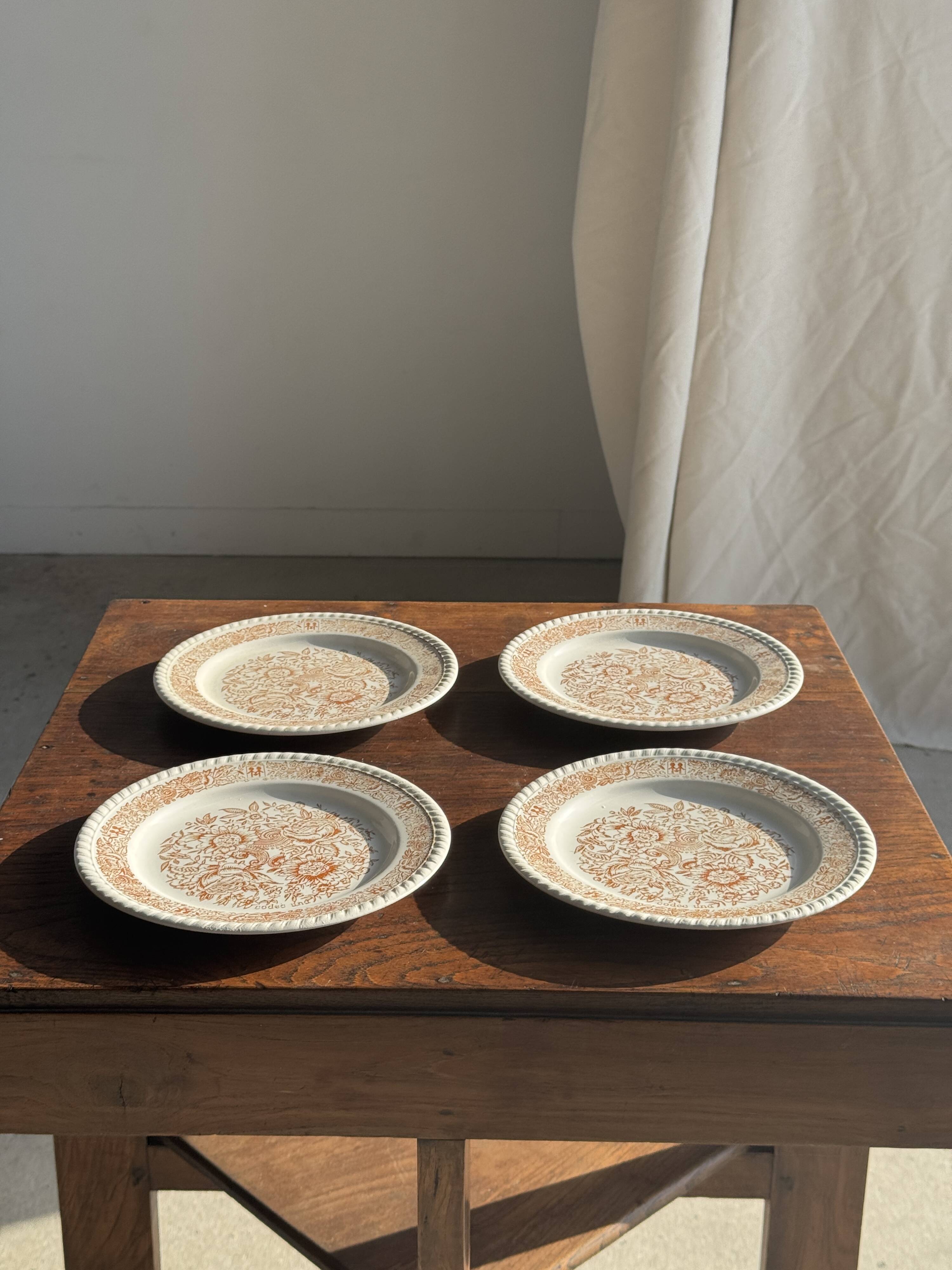 Set of 4 small dessert plates with a vintage stylised flower pattern.