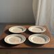 Set of 4 small dessert plates with a vintage stylised flower pattern.