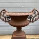 Large cast iron vase with pedestal