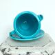 Milk jug on plate