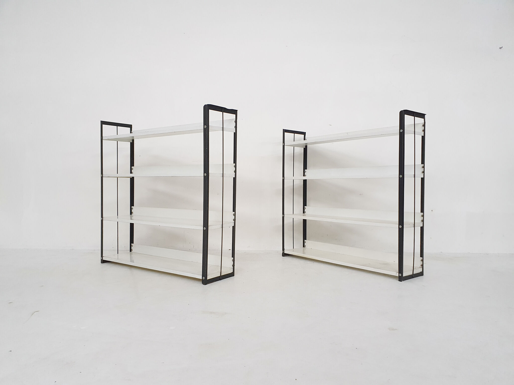 Set of two black and white metal book shelves attrb. to Tomado, Holland, 1950's