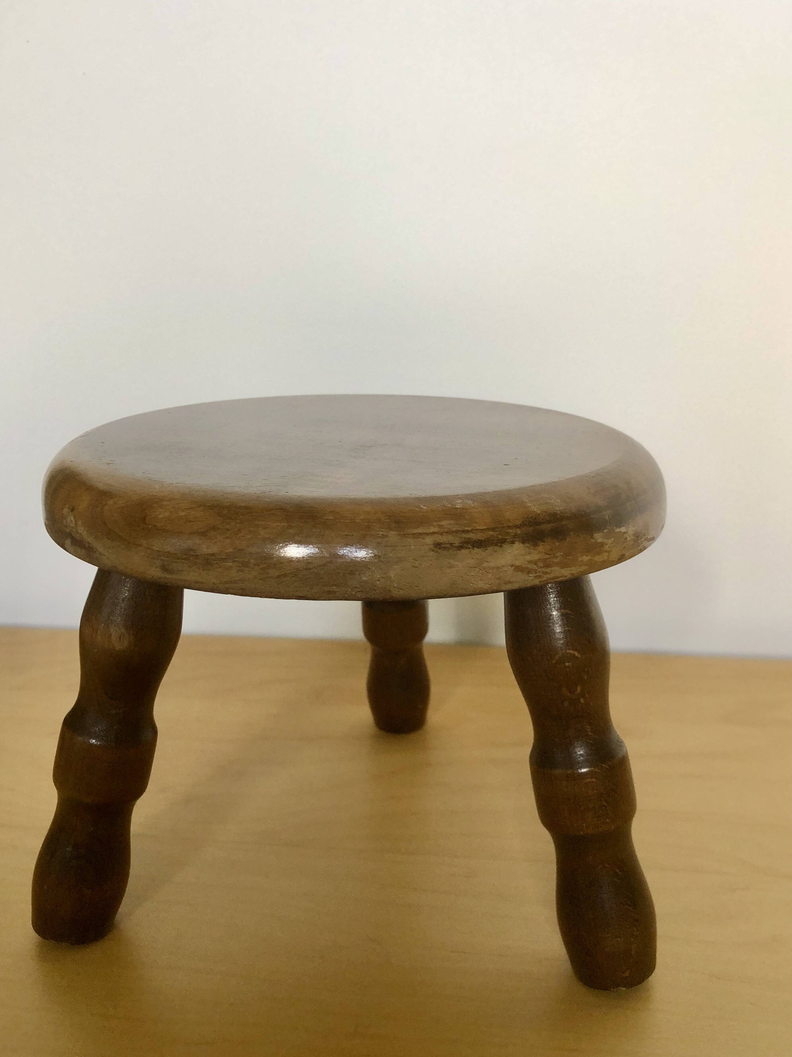 Low tripod stool in solid wood