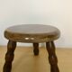 Low tripod stool in solid wood