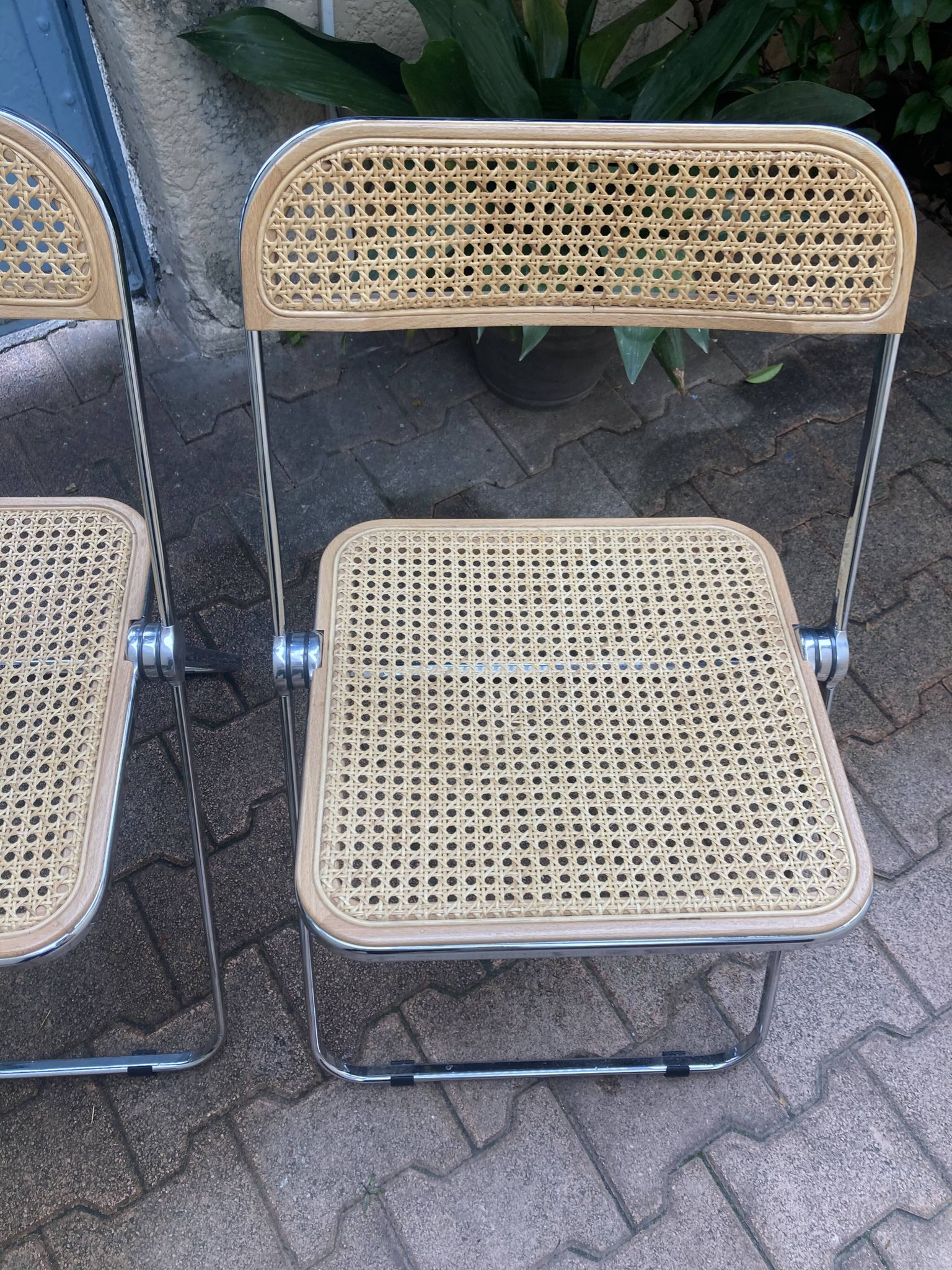 Plia chairs by Castelli in wood and cane.