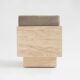 Cubic travertine stool with velvet cushion