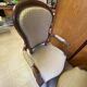 Two Louis XV style wooden and fabric armchairs