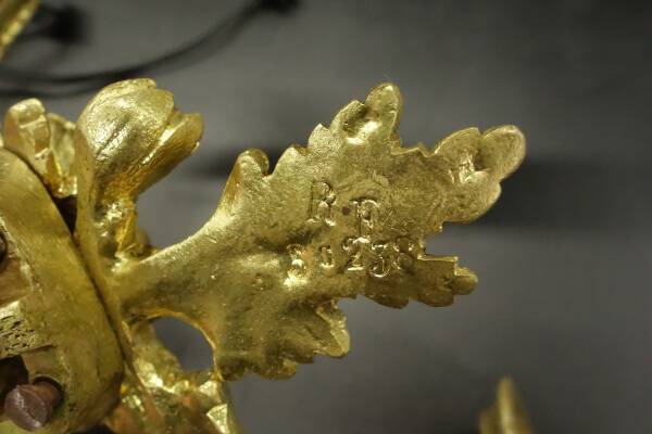 Pair of large wall sconces with flowers in the Louis XVI style from the 19th century - gilded bronze.