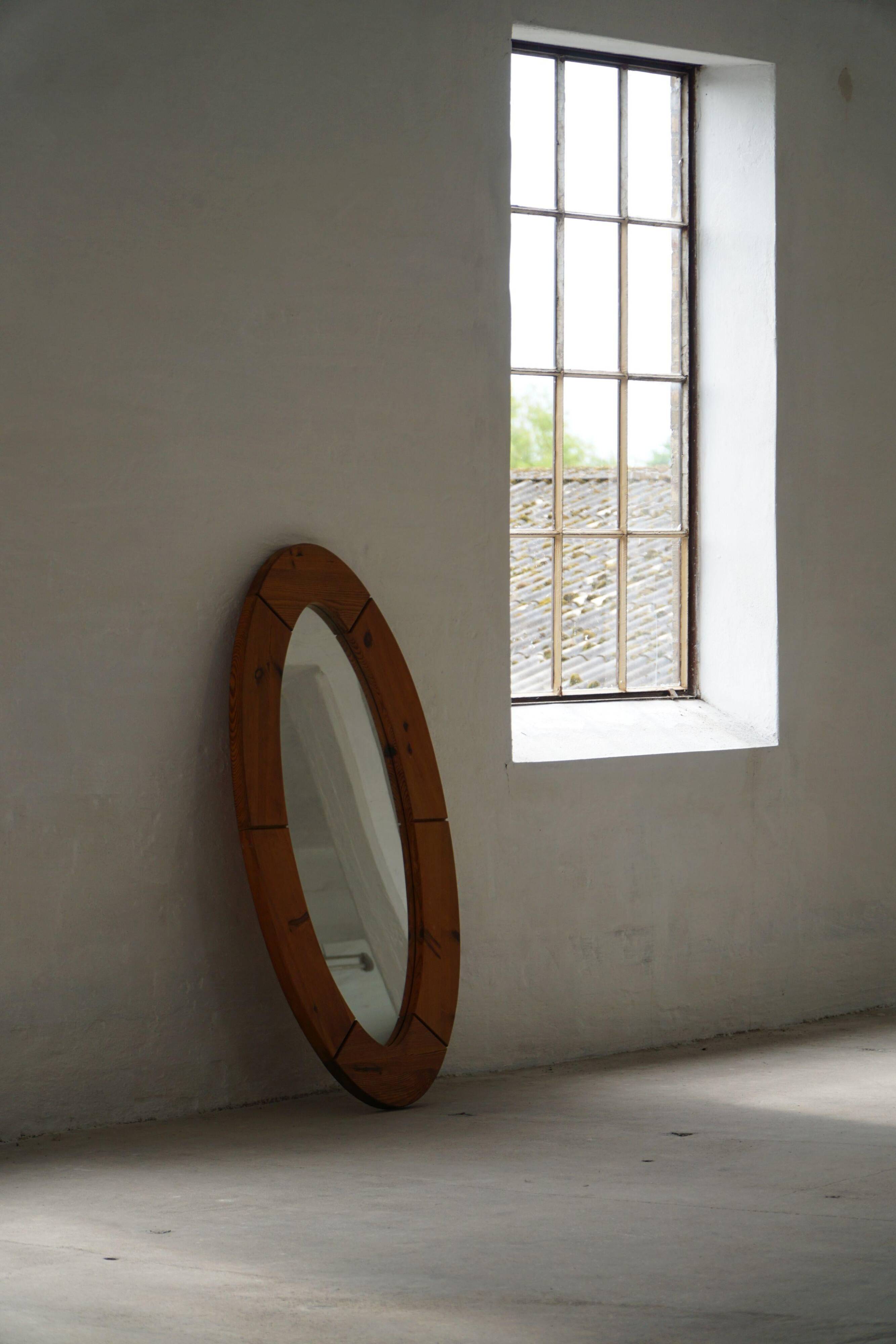 Large oval wall mirror in solid pine by Glasmäster Markaryd, Sweden, 1960s.
