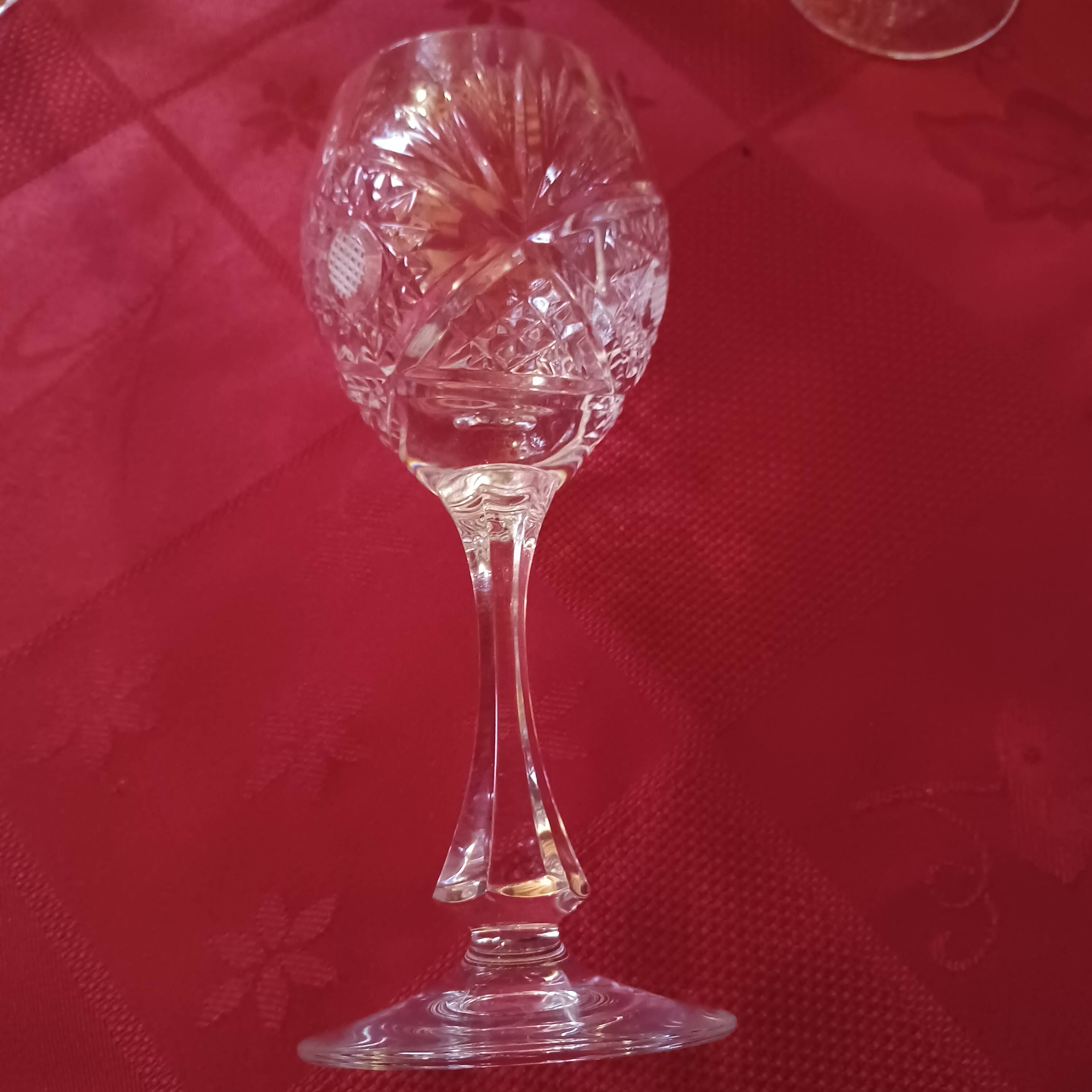 Crystal wine glasses cut by Baccarat with a jug.