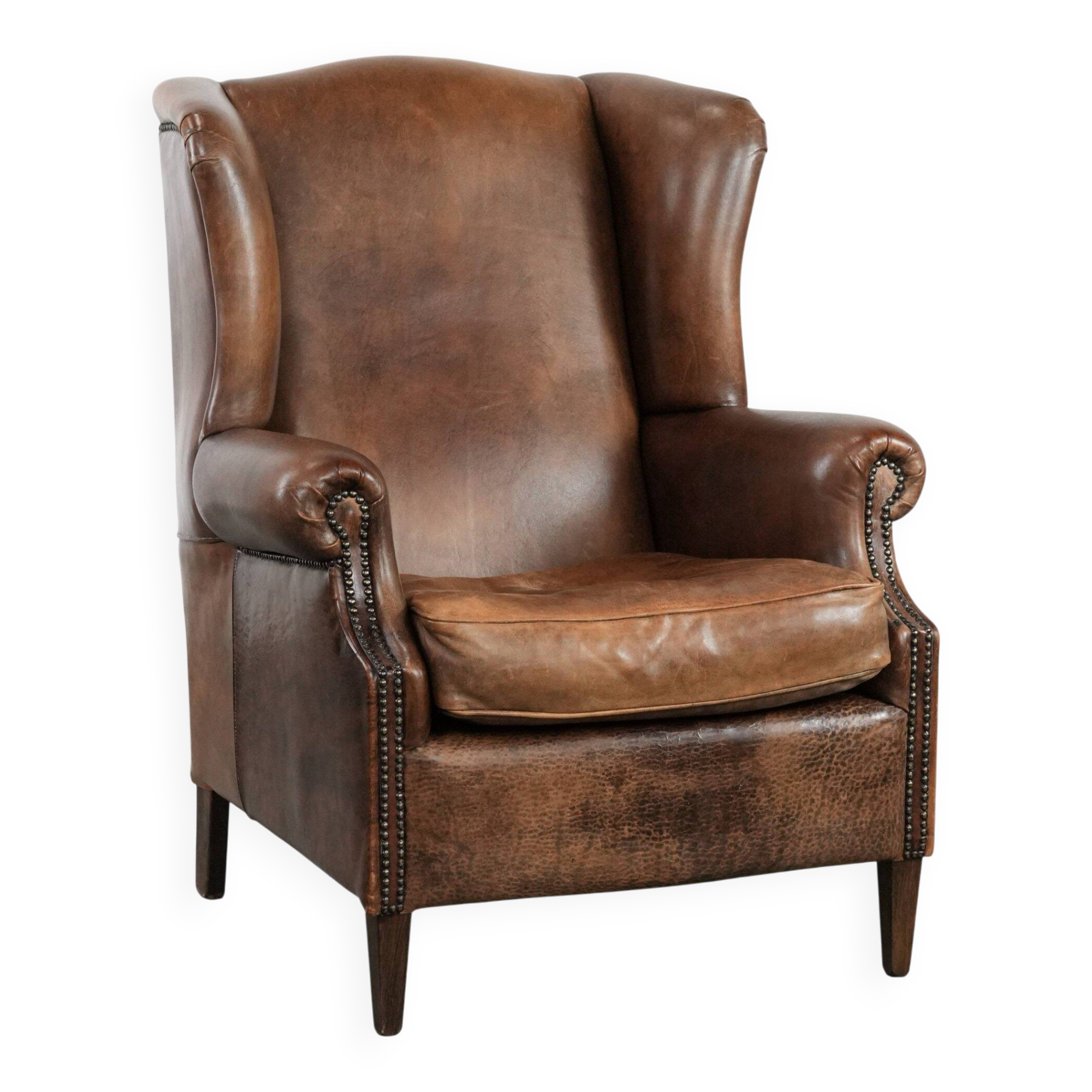 Warm, cosy and comfortable vintage sheepskin ear armchair with character
