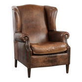 Warm, cosy and comfortable vintage sheepskin ear armchair with character
