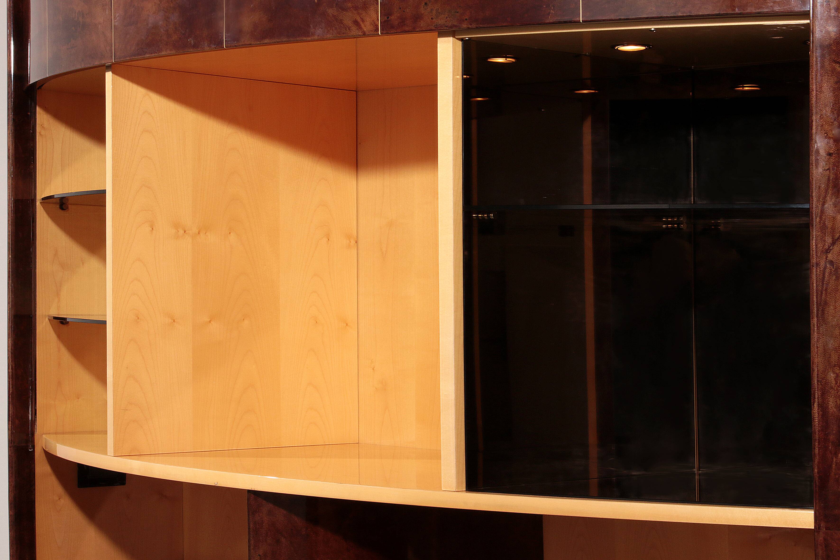 Iconic Aldo Tura brown goatskin bar cabinet with electric lift & mirror interior.