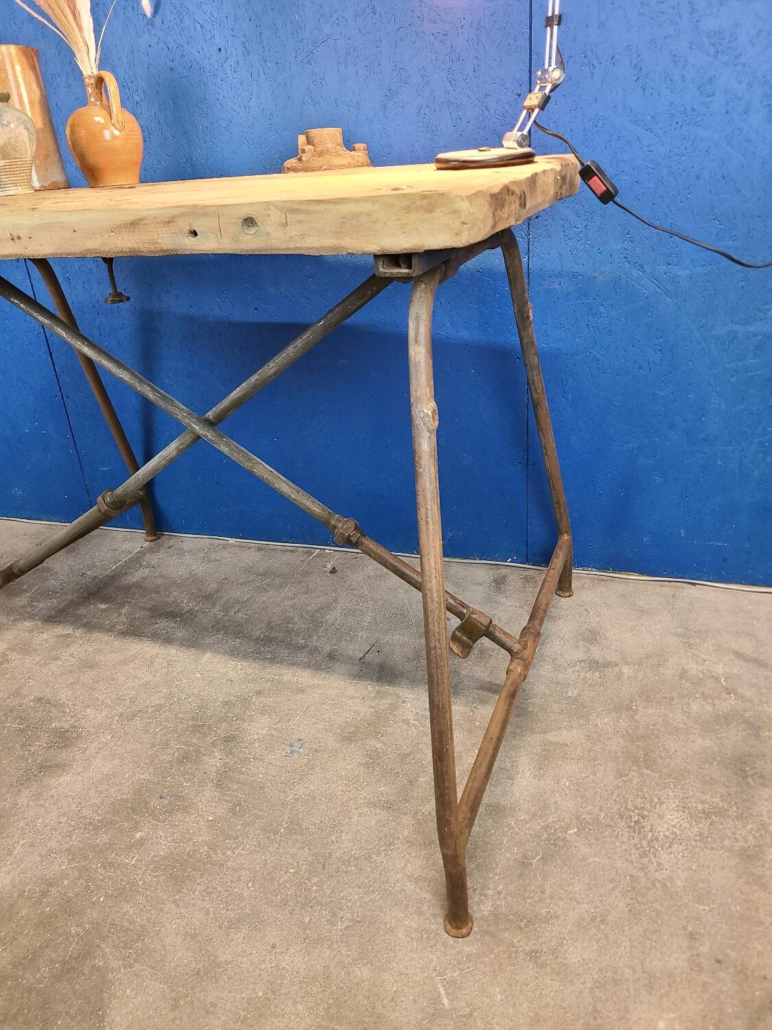 Vintage workbench circa 1930, folding metal leg.