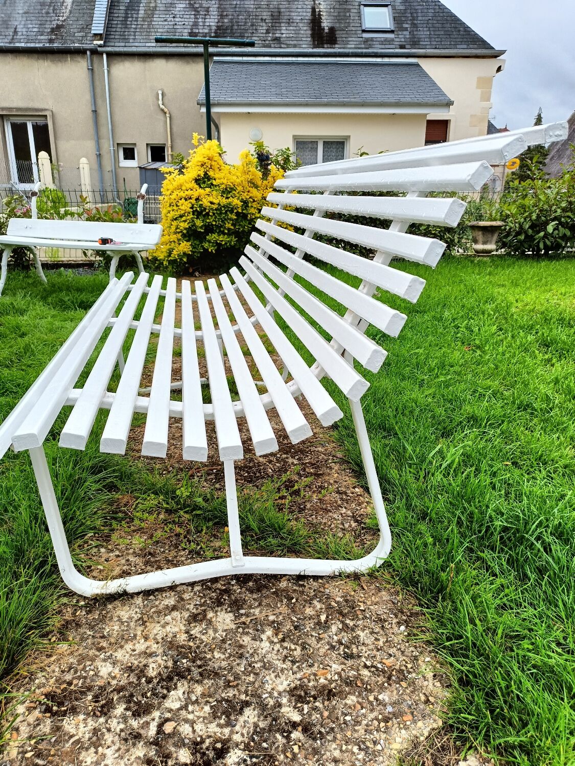 Antique garden bench with metal legs