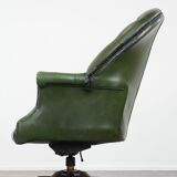 Large green cowhide Chesterfield office chair in English style on wheels