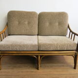 Two-seater rattan sofa with natural tones