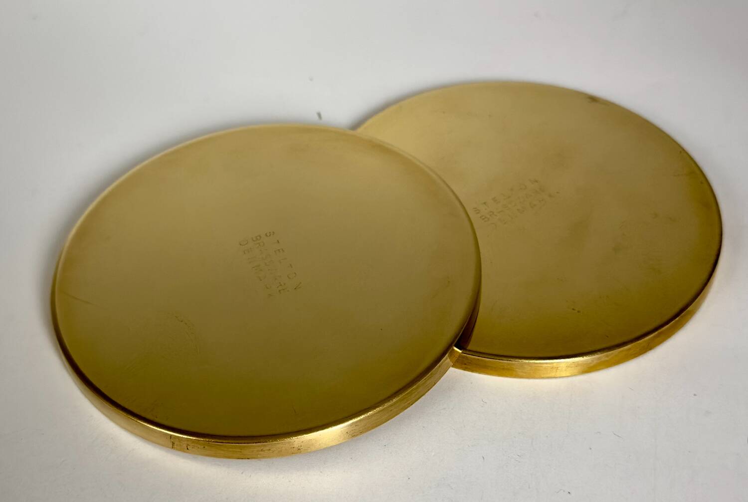 6 Coasters. Stelton. Brass