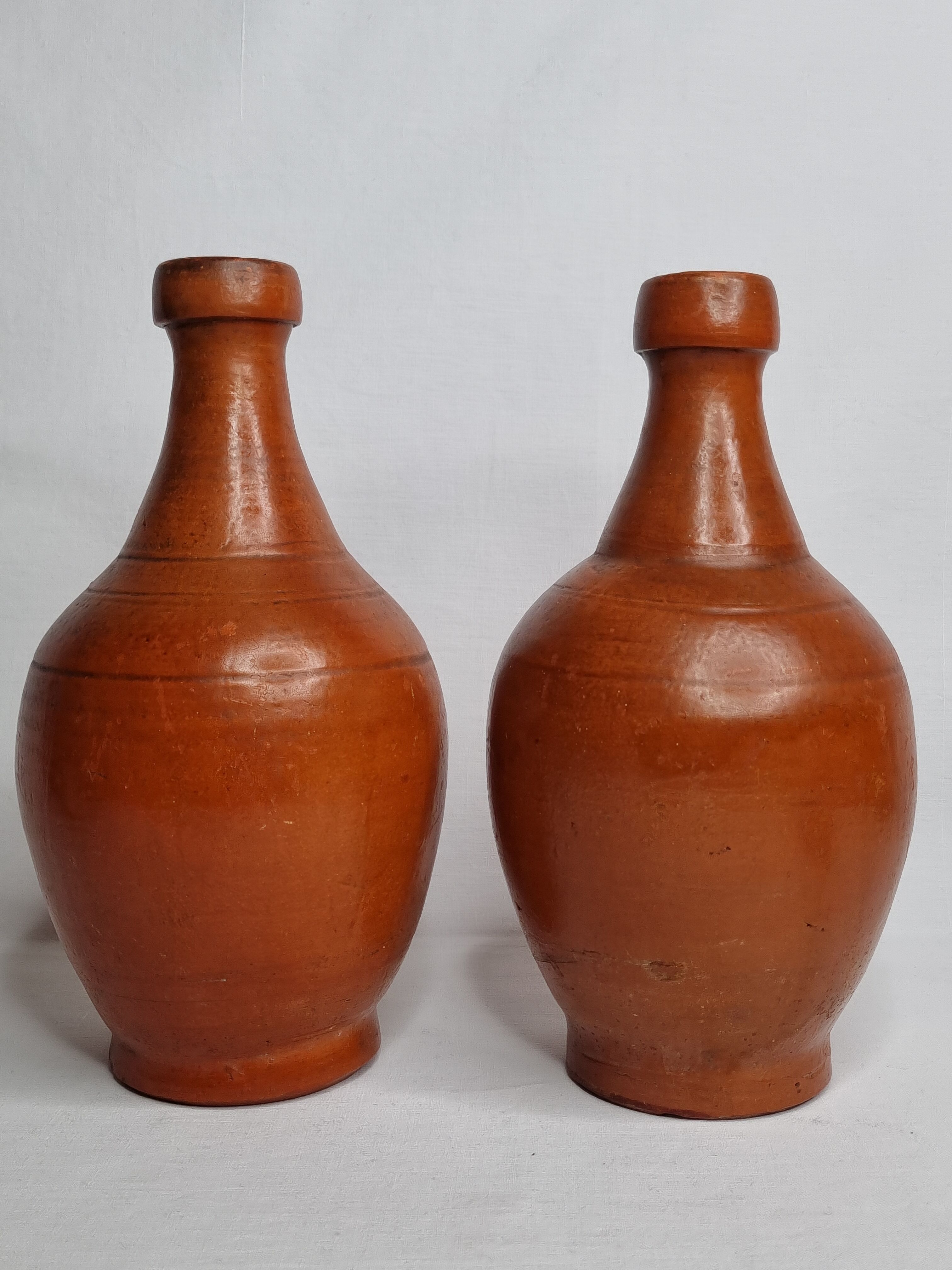 Pair of glazed terracotta jars, 26 cm