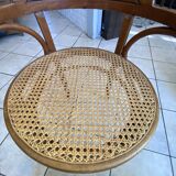 Bistro chair with a curved wooden frame and caned seat from the 1930s.
