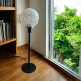 Table lamp with an antique textured glass globe