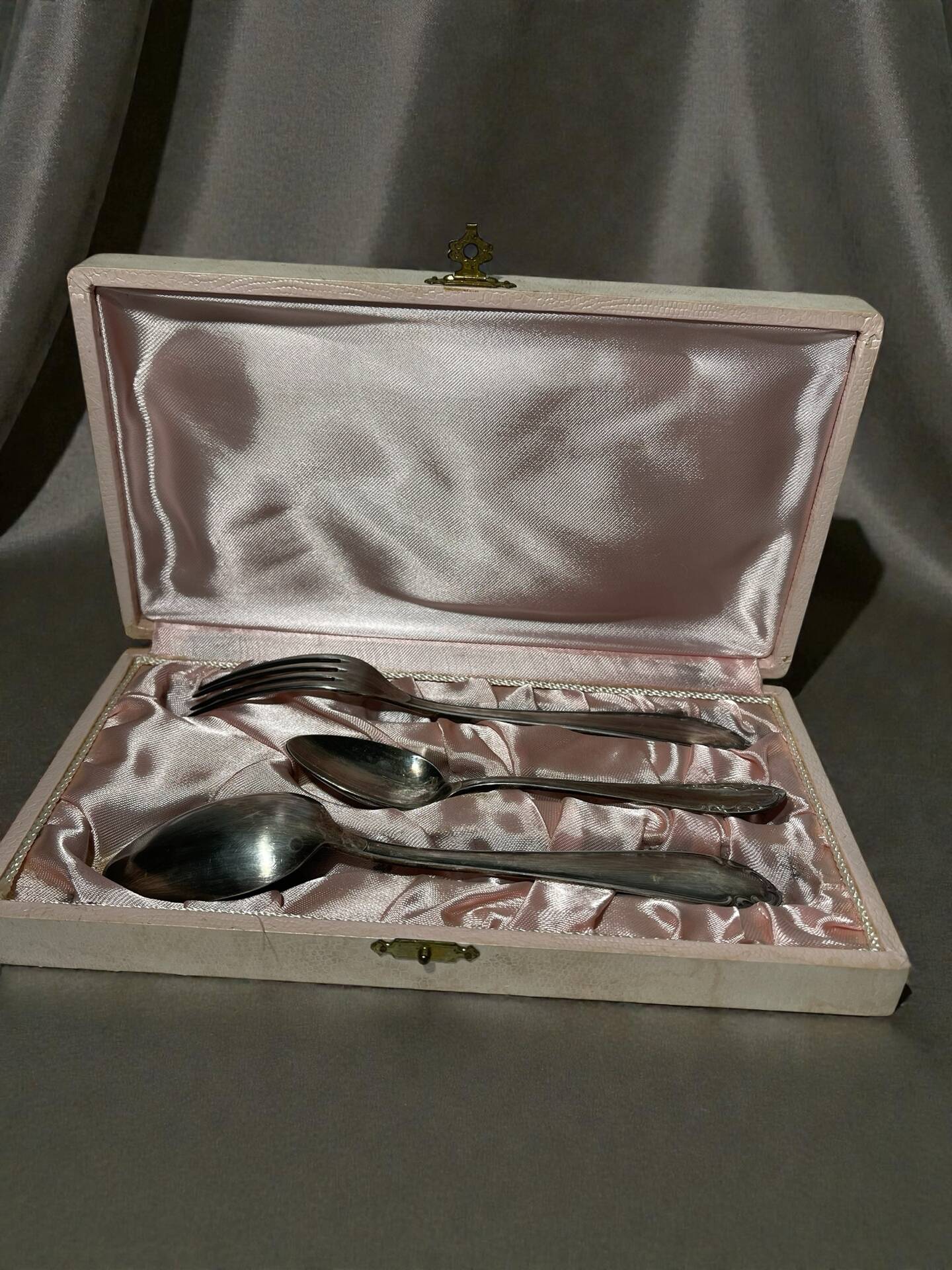 Set of antique silver-plated cutlery for children.