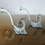 Pair of enameled cast iron coat hooks, 19th