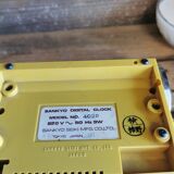 Yellow vintage sankyo alarm clock