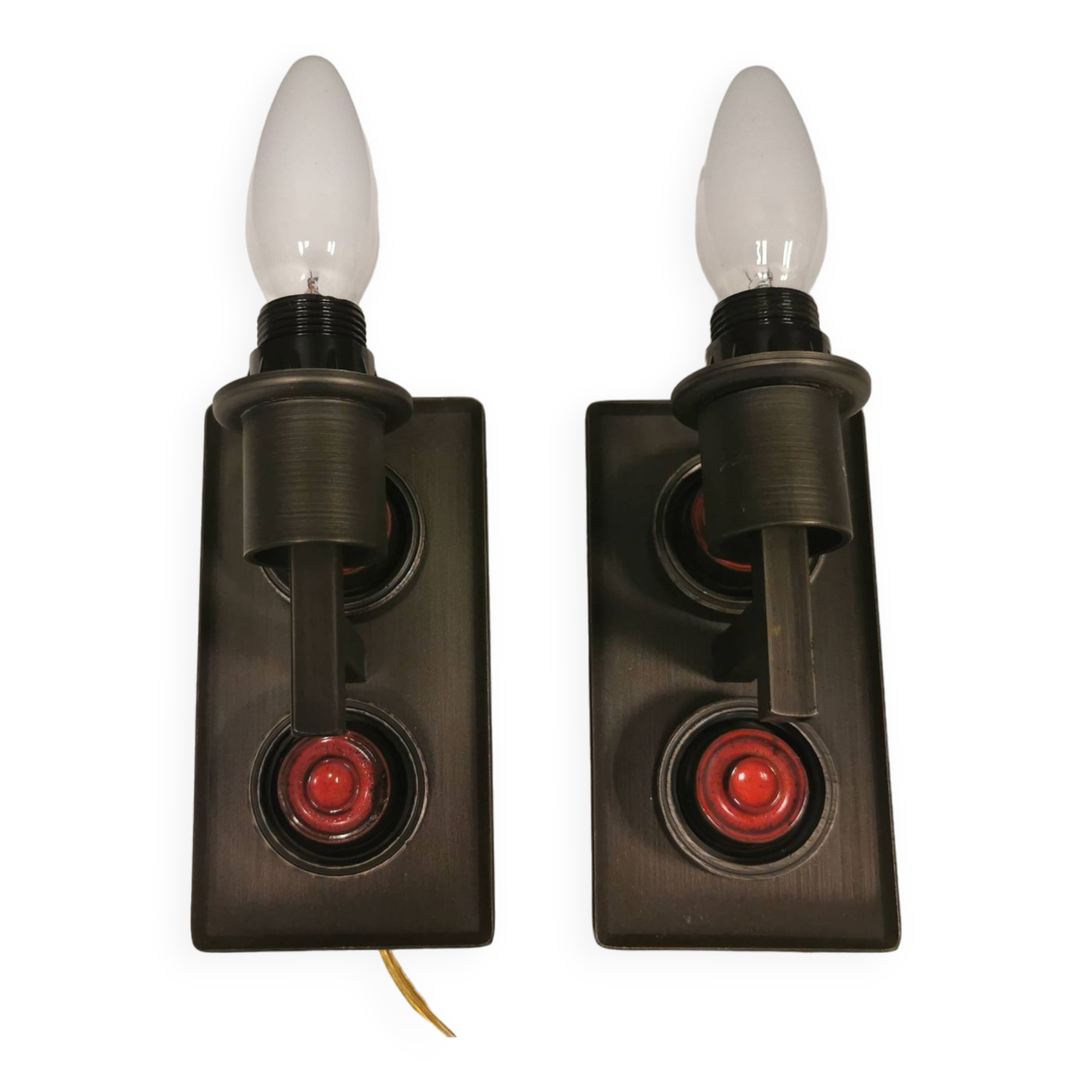 A set of Vitrika Denmark, cast iron wall lights with red details.