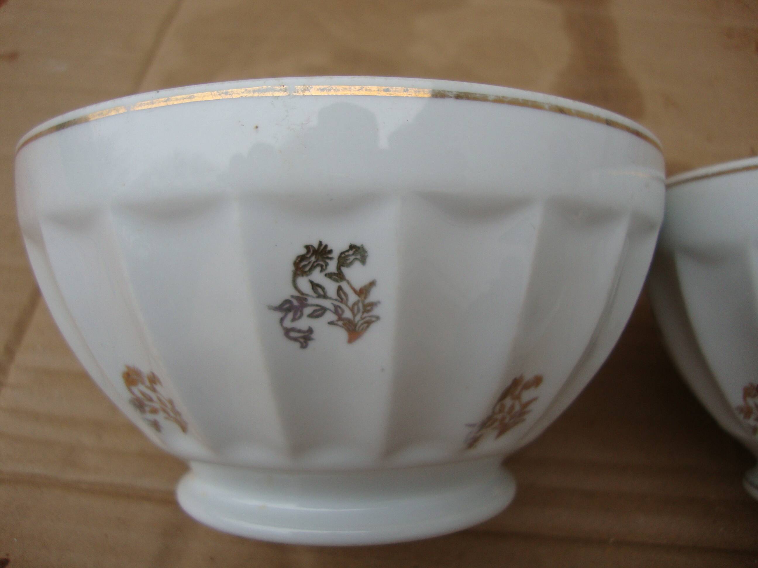 Set of 2 old ribbed white Longchamp porcelain bowls with gold decoration