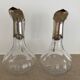Glass decanters and silver metal spouts