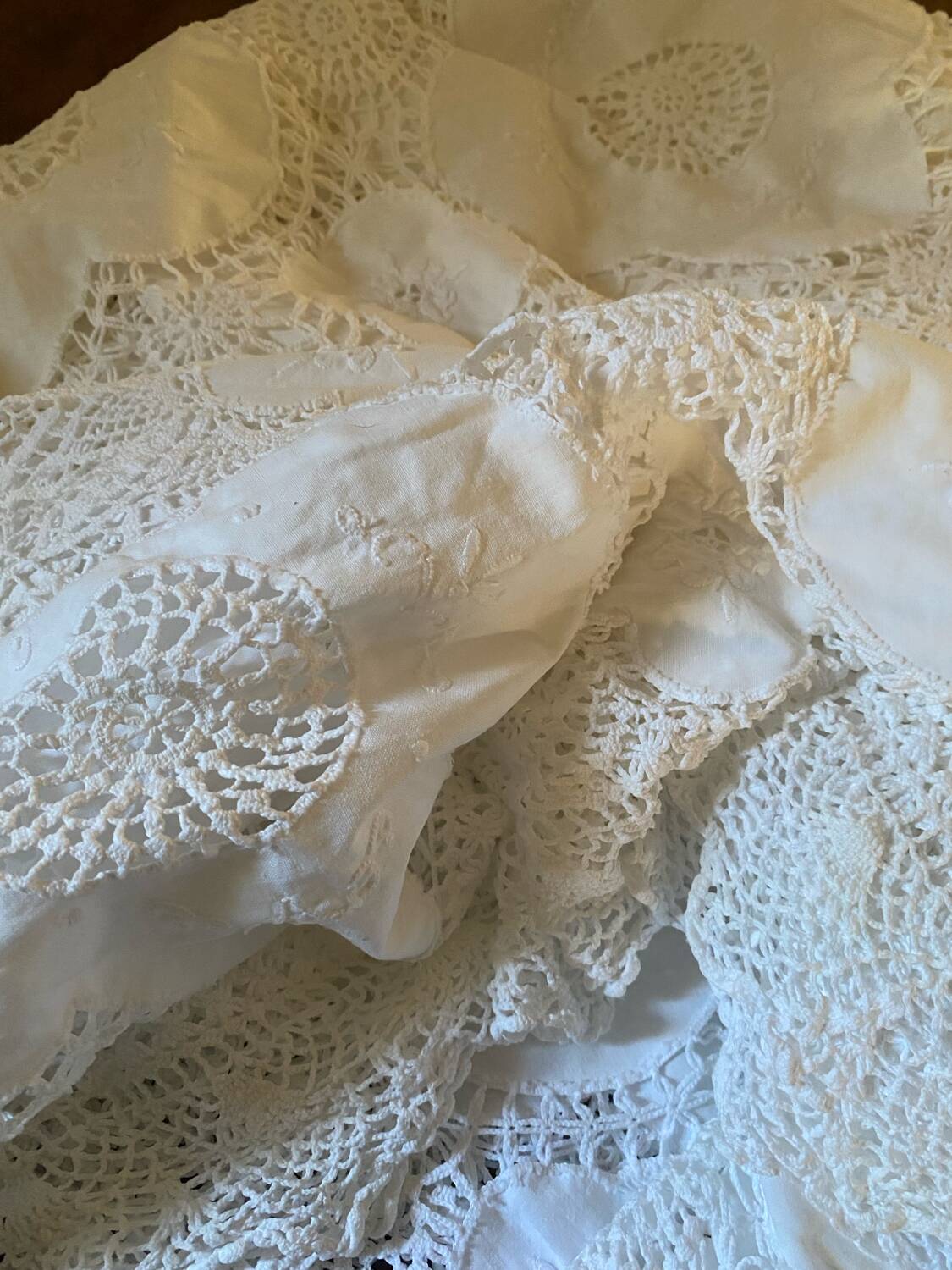 White cotton tablecloth with crochet lace.