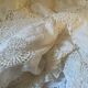 White cotton tablecloth with crochet lace.