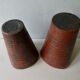 Pair of red enamelled terracotta vases, signed