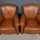 Paire de fauteuils club en cuir