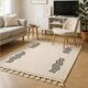 Tapis berbère écru à motifs ondulés noirs