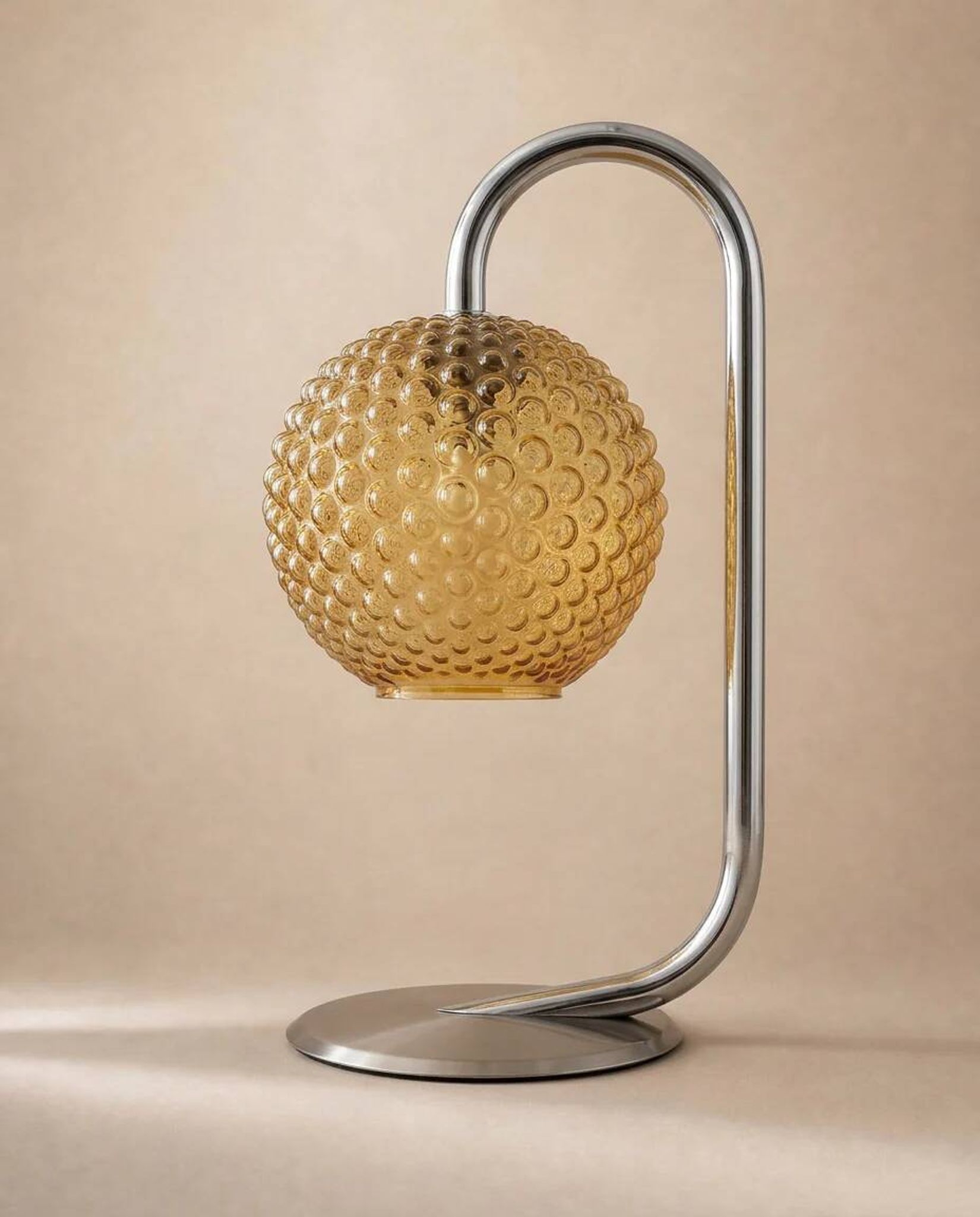 Chrome and amber glass table lamp, attributed to Rolf Krüger, 1970s.